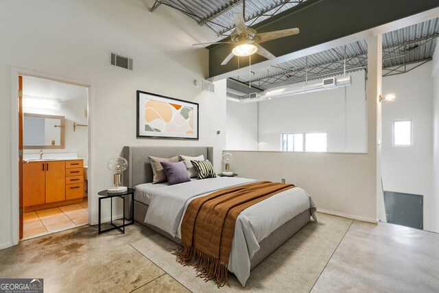 unfurnished room featuring a towering ceiling and ceiling fan