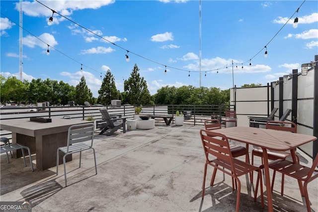 view of patio featuring outdoor dining area