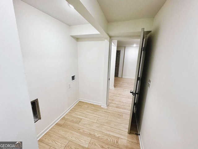 hall with light hardwood / wood-style flooring