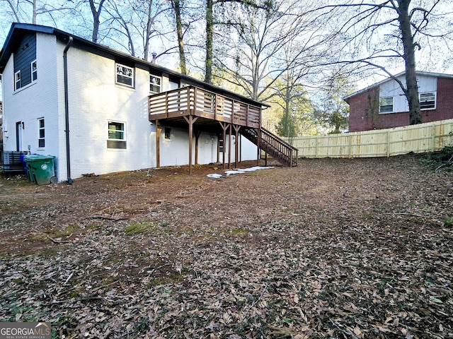 rear view of property with a wooden deck