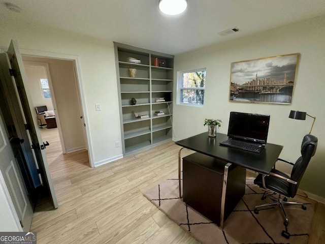 office area with light wood-type flooring