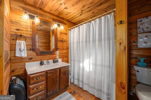 full bathroom with wood walls, hardwood / wood-style floors, toilet, vanity, and wood ceiling