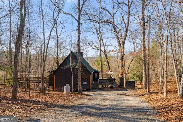 view of side of property featuring a deck