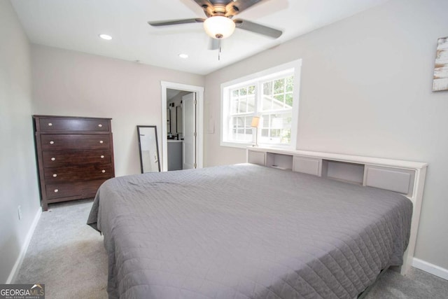 bedroom featuring light colored carpet and ceiling fan