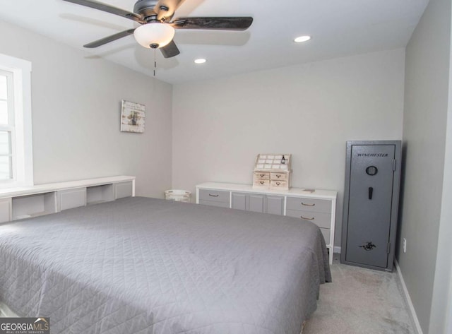 bedroom with light carpet and ceiling fan