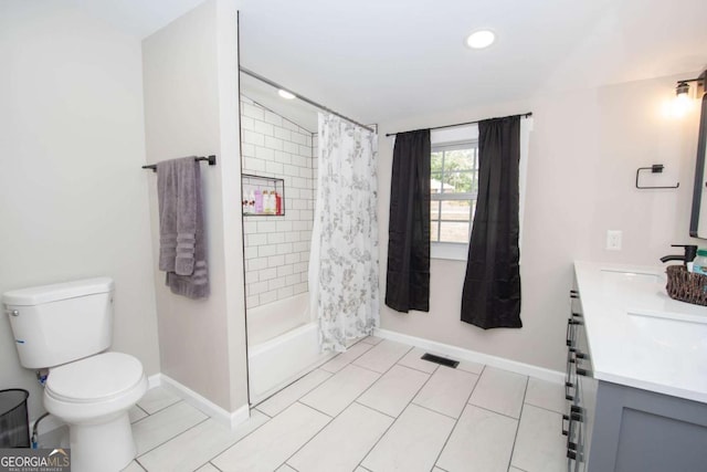 full bathroom with tile patterned flooring, shower / tub combo, vanity, and toilet