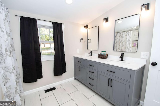 bathroom with vanity and tile patterned floors