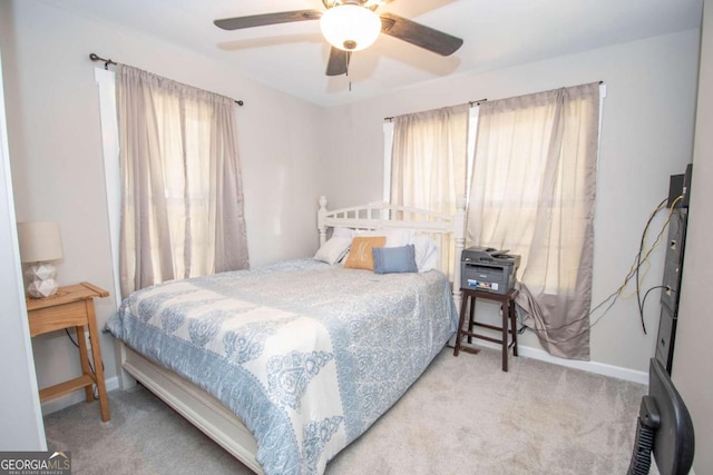 bedroom with ceiling fan and light colored carpet