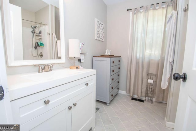 bathroom with tile patterned flooring and vanity