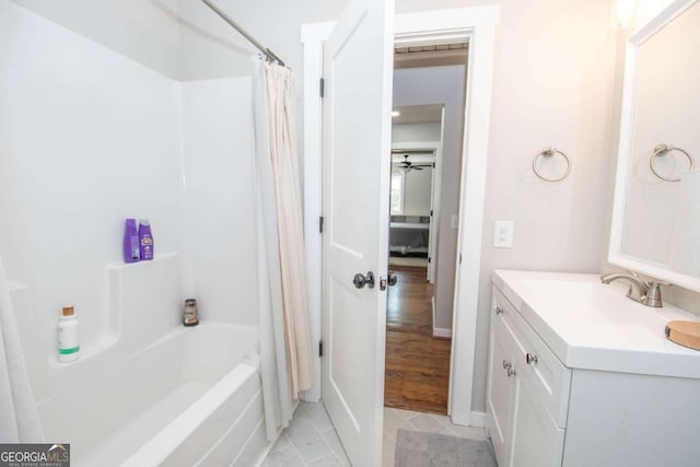 bathroom featuring tile patterned floors, ceiling fan, vanity, and shower / tub combo