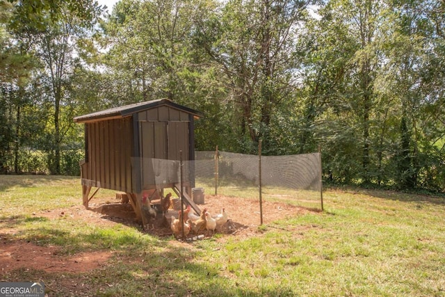 view of outdoor structure featuring a lawn