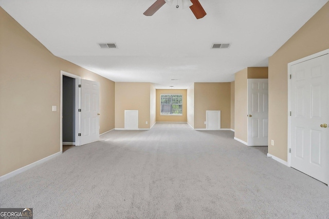 unfurnished room with ceiling fan and light colored carpet