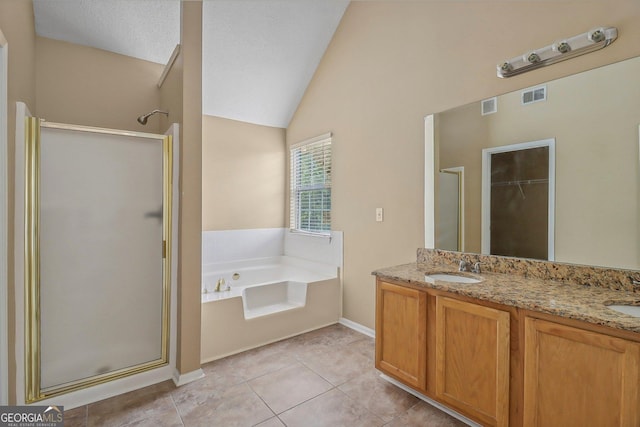 bathroom featuring tile patterned floors, vanity, lofted ceiling, and shower with separate bathtub