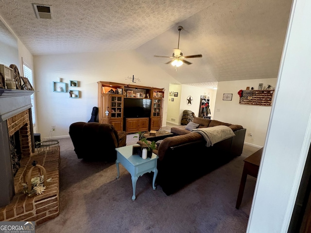 504 Plantation Creek Dr, Loganville, GA 30052 - carpeted living room with a textured ceiling, a ceiling fan, visible vents, a brick fireplace, and lofted ceiling