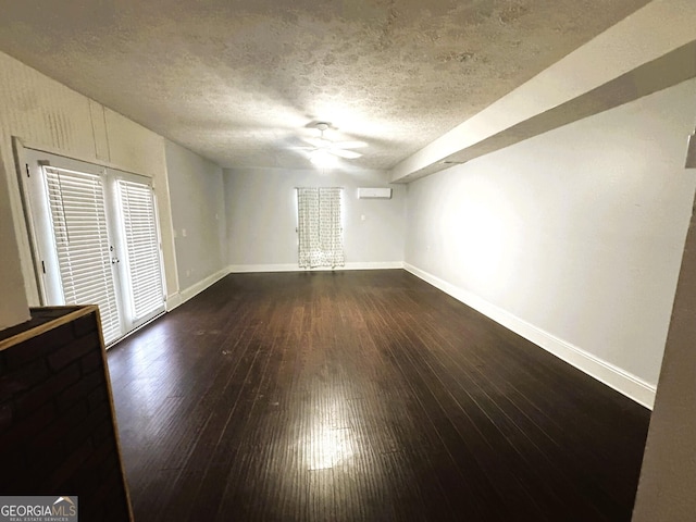 504 Plantation Creek Dr, Loganville, GA 30052 - unfurnished room with a ceiling fan, a textured ceiling, baseboards, and dark wood-style floors