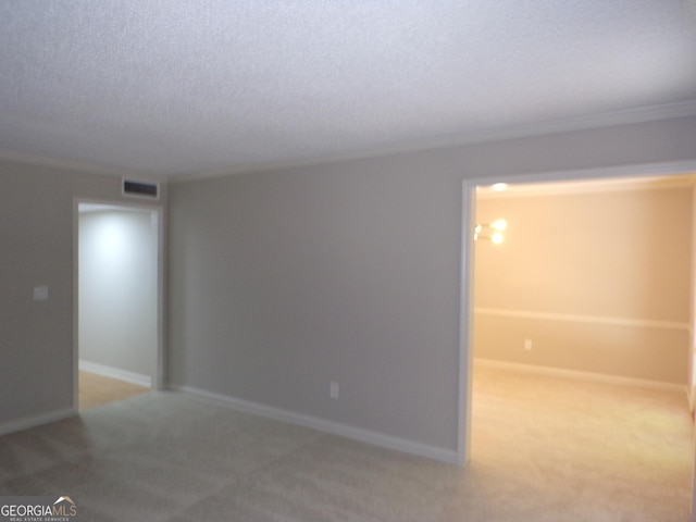 carpeted spare room with ornamental molding