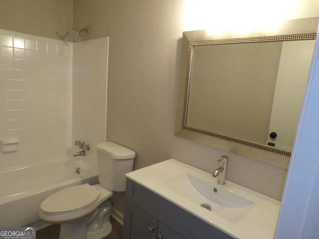 full bathroom featuring vanity, bathtub / shower combination, and toilet