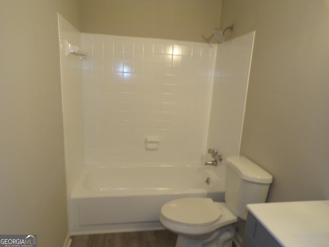 full bathroom with hardwood / wood-style floors, vanity, toilet, and bathing tub / shower combination