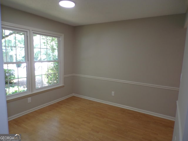 empty room featuring hardwood / wood-style flooring