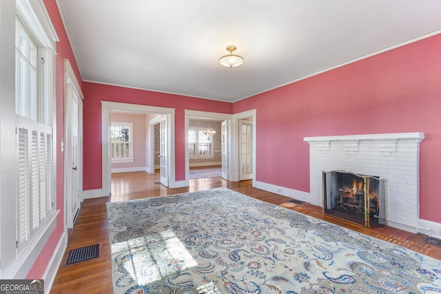 interior space featuring a brick fireplace and hardwood / wood-style floors