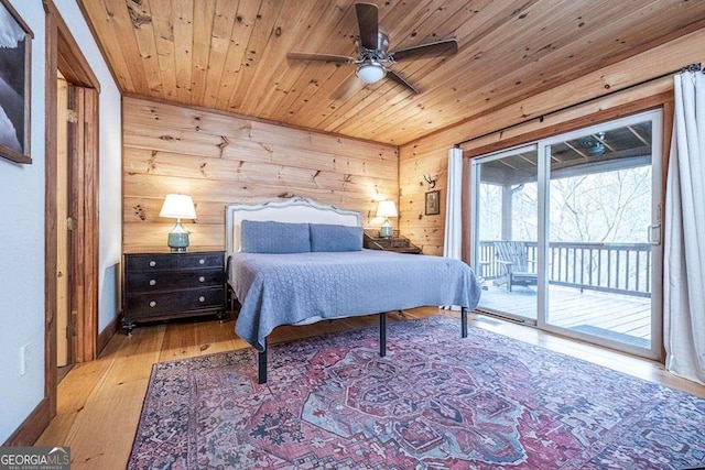 bedroom with access to exterior, light hardwood / wood-style flooring, ceiling fan, and wood ceiling