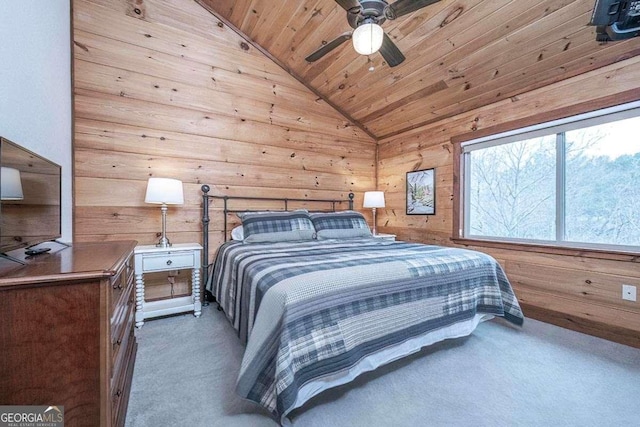 bedroom featuring wooden ceiling, lofted ceiling, dark colored carpet, wooden walls, and ceiling fan