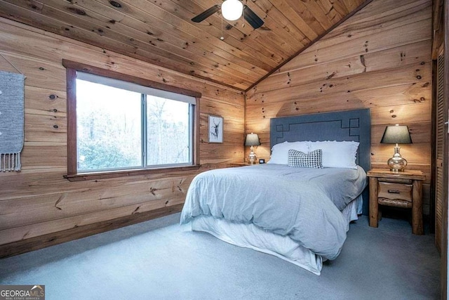 carpeted bedroom featuring ceiling fan, wooden walls, wooden ceiling, and lofted ceiling