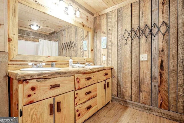 bathroom featuring vanity, wood-type flooring, wood ceiling, and wooden walls