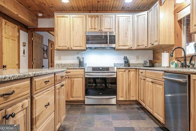 kitchen with sink, light brown cabinets, wooden ceiling, light stone counters, and appliances with stainless steel finishes