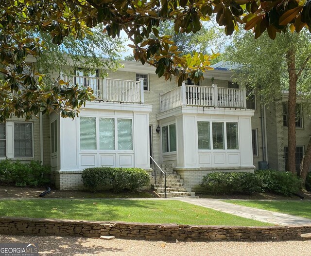 view of front of home with a balcony