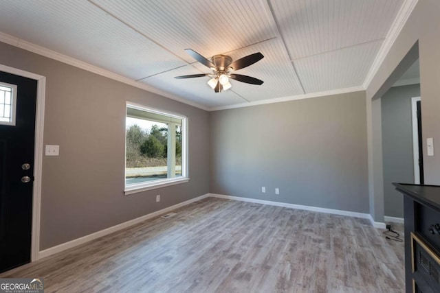 unfurnished living room featuring ceiling fan, light hardwood / wood-style floors, and ornamental molding