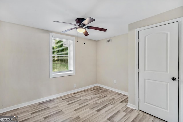 spare room with ceiling fan and light hardwood / wood-style floors