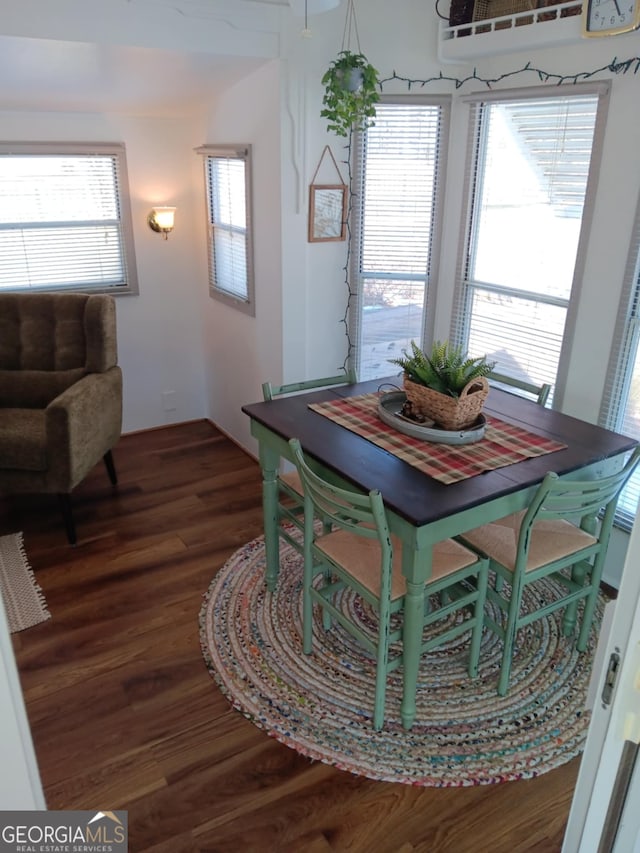 dining area with dark wood-type flooring