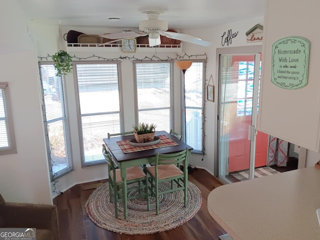 dining space with wood-type flooring and ceiling fan