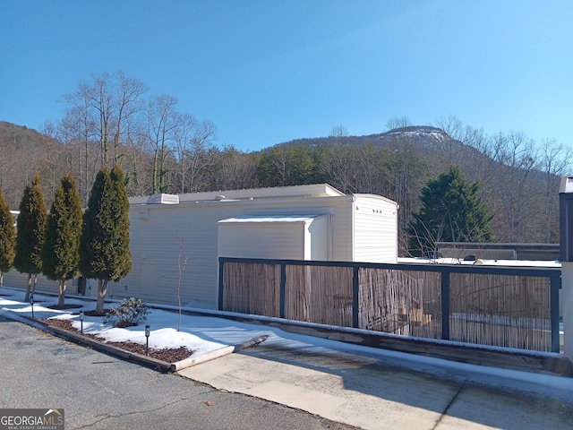 view of side of property featuring a mountain view