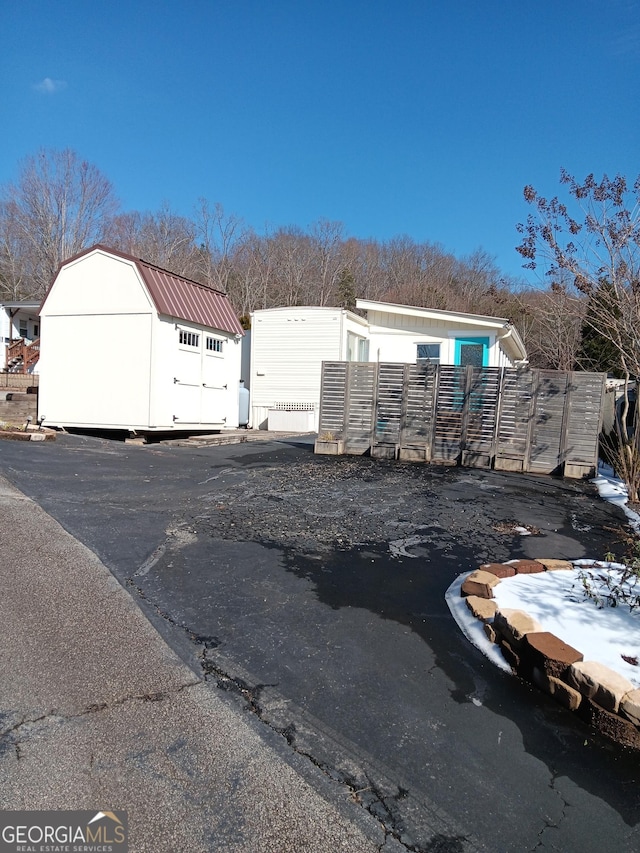 exterior space with a storage shed