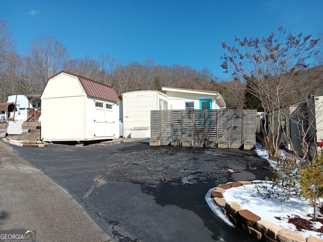 exterior space featuring a storage shed