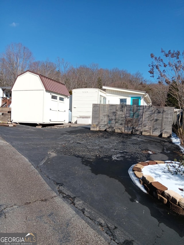 exterior space with a shed