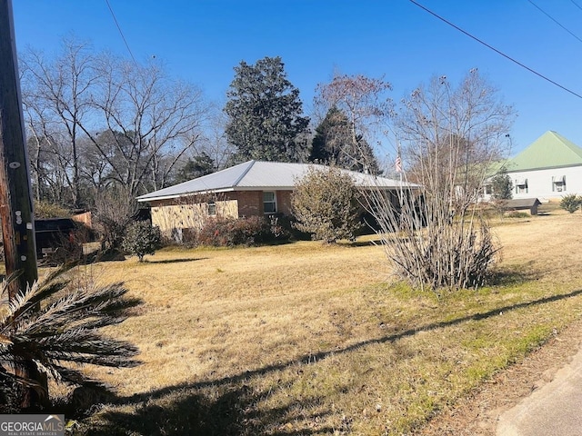 exterior space with a front lawn