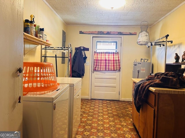 laundry area with a textured ceiling, washing machine and dryer, electric water heater, and ornamental molding