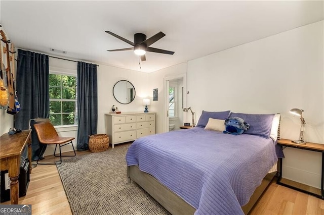 bedroom featuring light wood-type flooring and ceiling fan