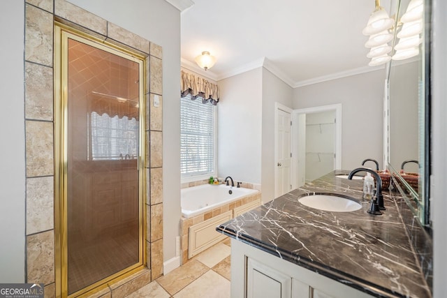 bathroom featuring double vanity, crown molding, a bath, a sink, and a shower stall