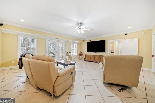 living area featuring baseboards, french doors, light tile patterned flooring, and ornamental molding