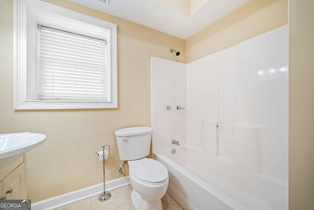 bathroom featuring vanity, baseboards, tile patterned floors, toilet, and shower / bathing tub combination