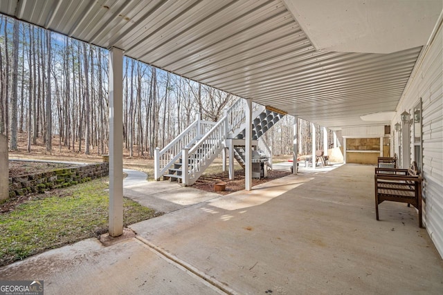 view of patio / terrace with a grill and stairs