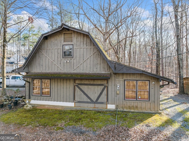 exterior space with a gambrel roof