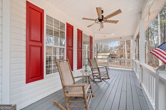 deck with a porch and a ceiling fan