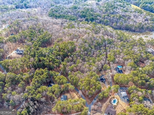 birds eye view of property with a wooded view