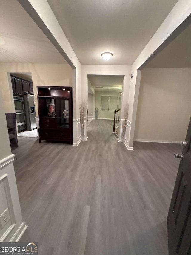 corridor featuring wood-type flooring