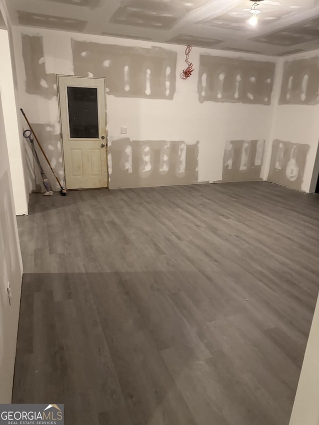 basement with hardwood / wood-style flooring